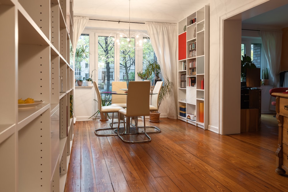 a dining room with a table and chairs