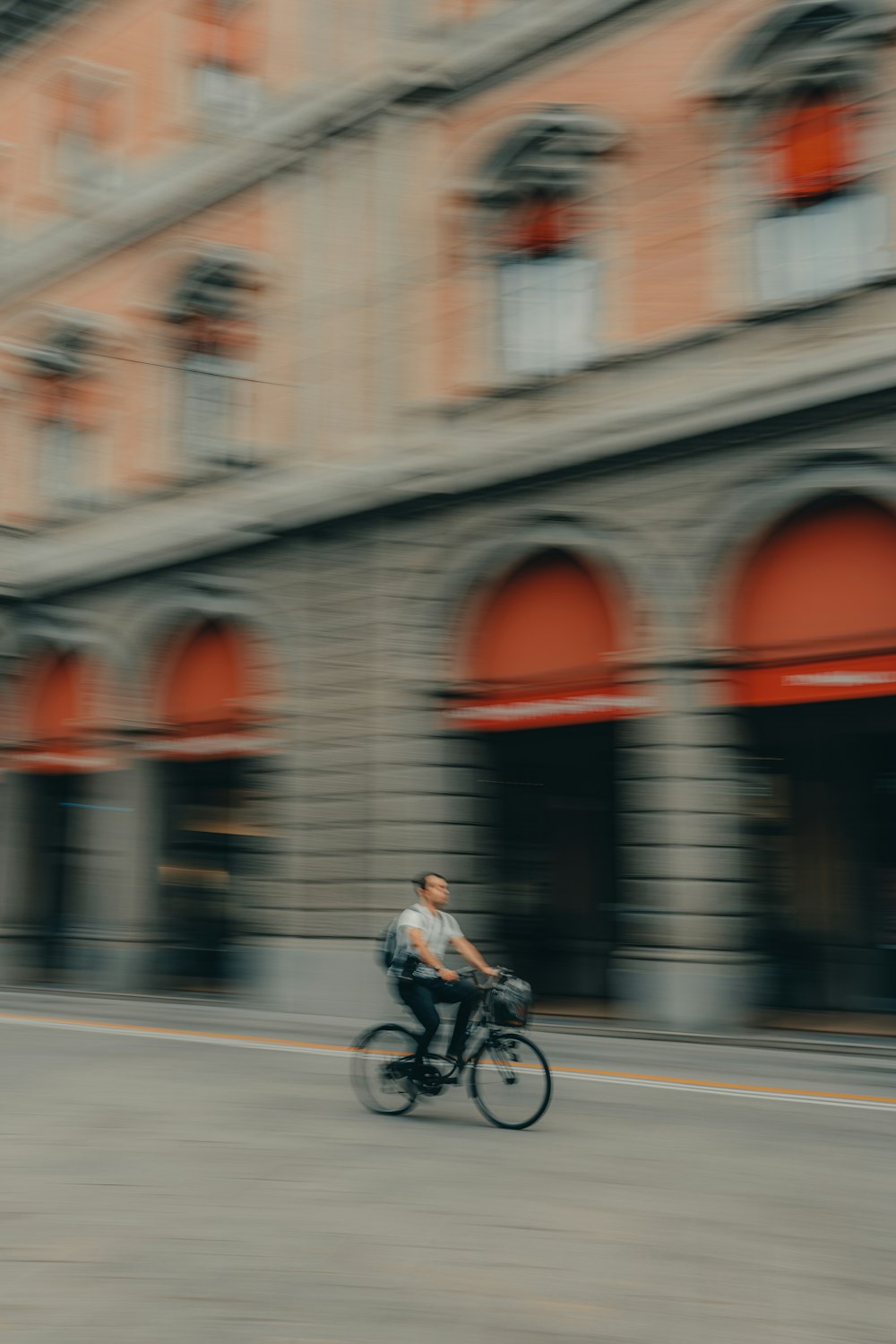 a blurry photo of a man riding a bike