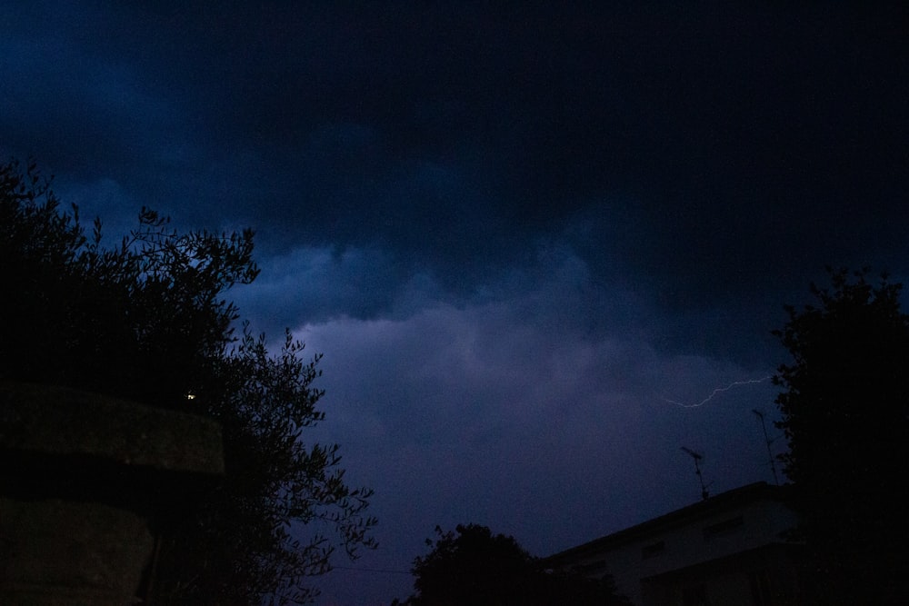 a dark sky with a lightning bolt in the distance