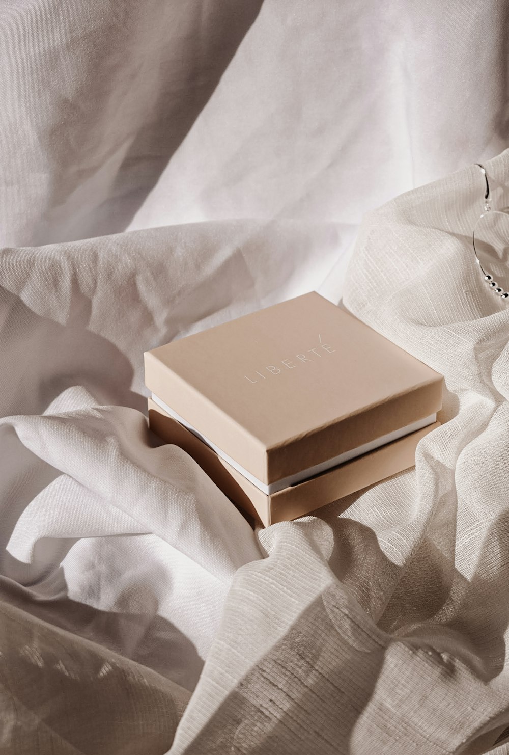 a book sitting on top of a white sheet