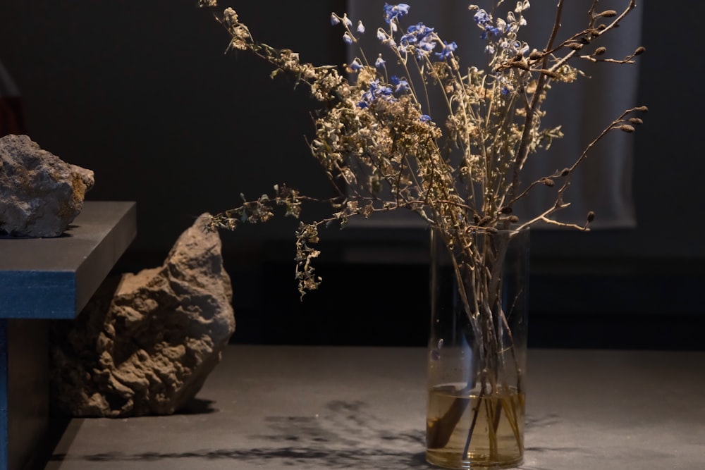 a vase filled with flowers sitting on top of a table