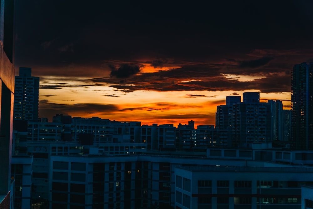 a view of a city at sunset from a high rise building