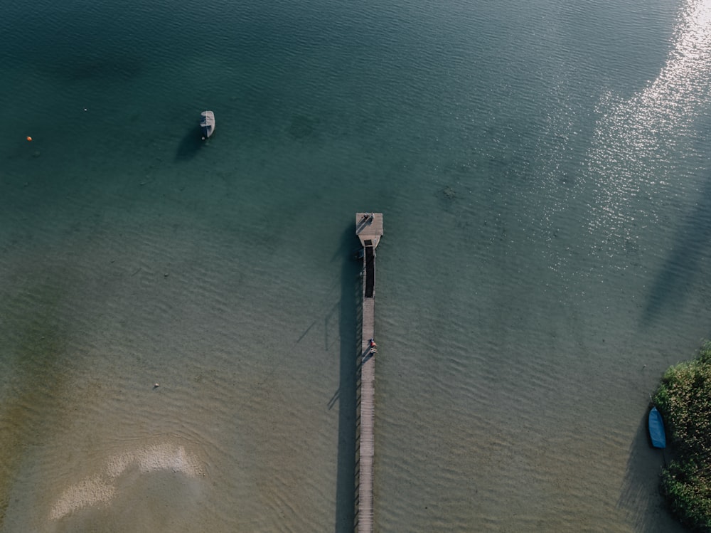 a pier in the middle of a body of water