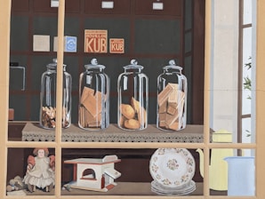 A cozy kitchen scene with jars of fish products lined up beside a basket of freshly baked crackers.