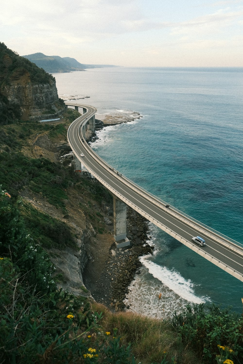a view of a highway going over the ocean