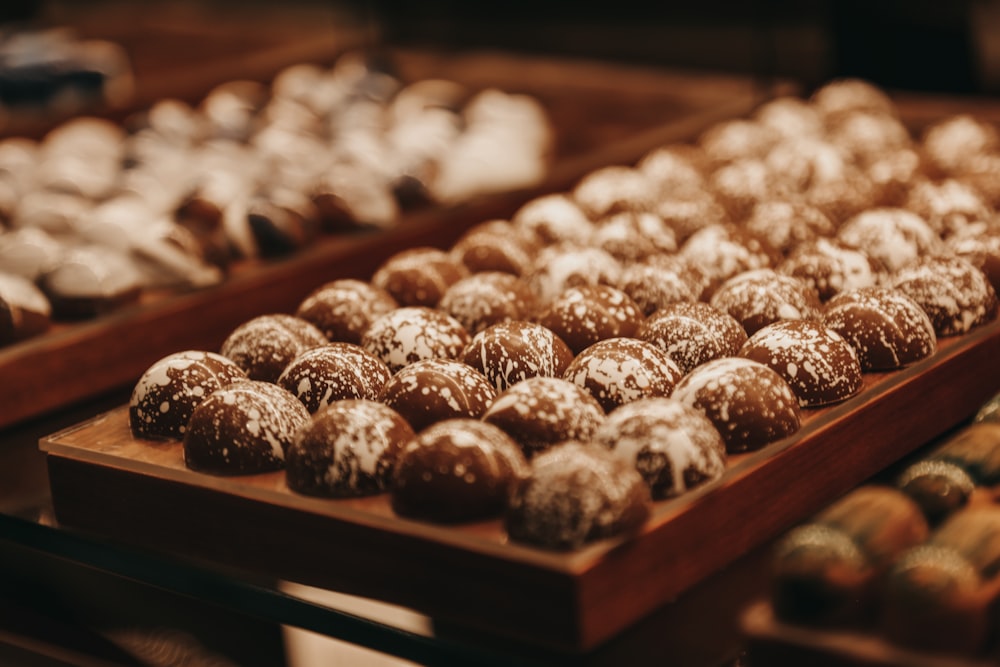 a close up of a tray of doughnuts