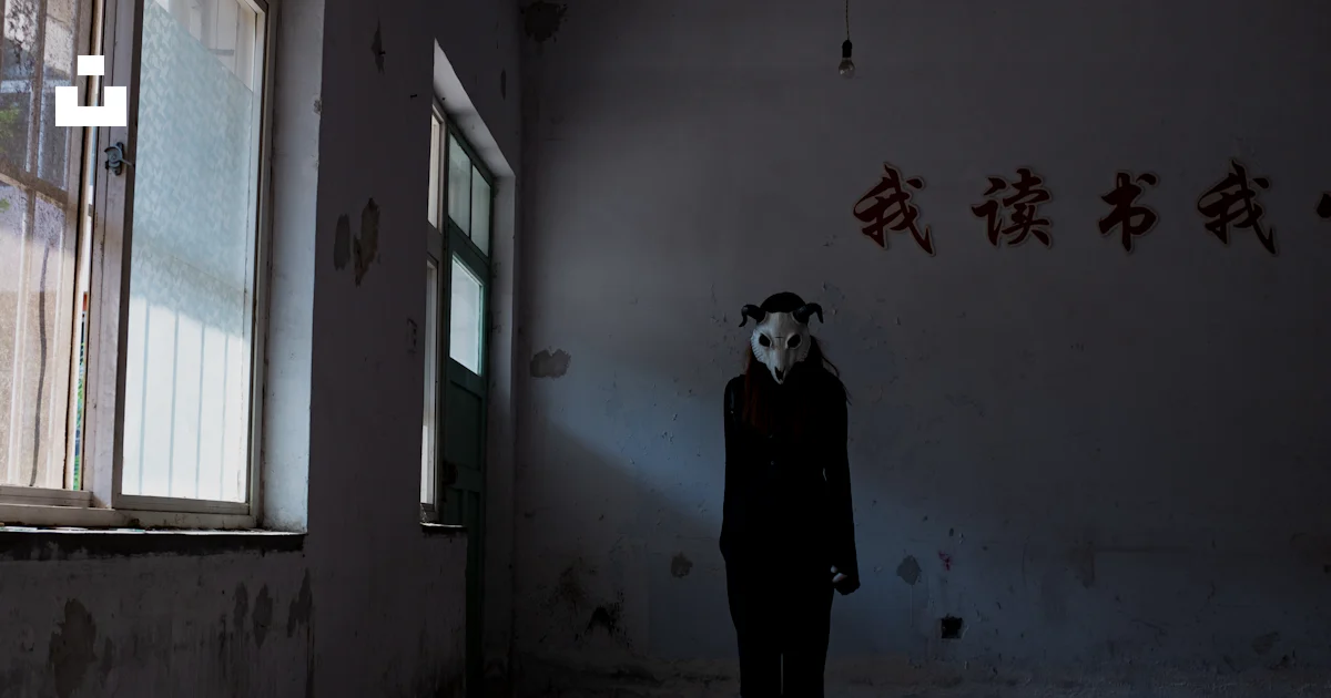 Alone Mask Image A person wearing a mask standing in a room photo – Free Girl alone ...