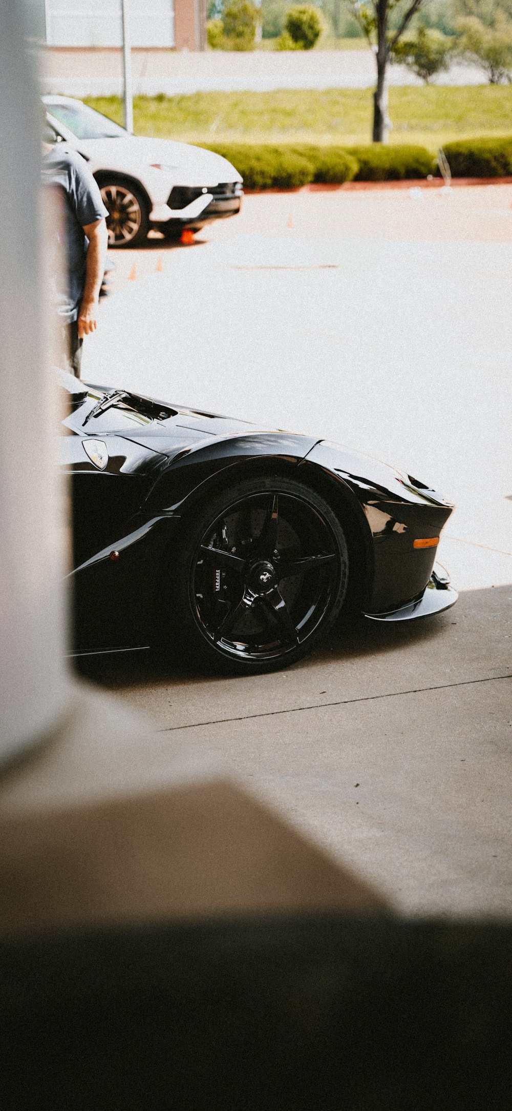 a black sports car parked in front of a building