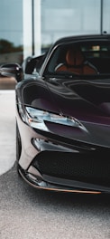Elevé Group a black sports car parked in front of a building