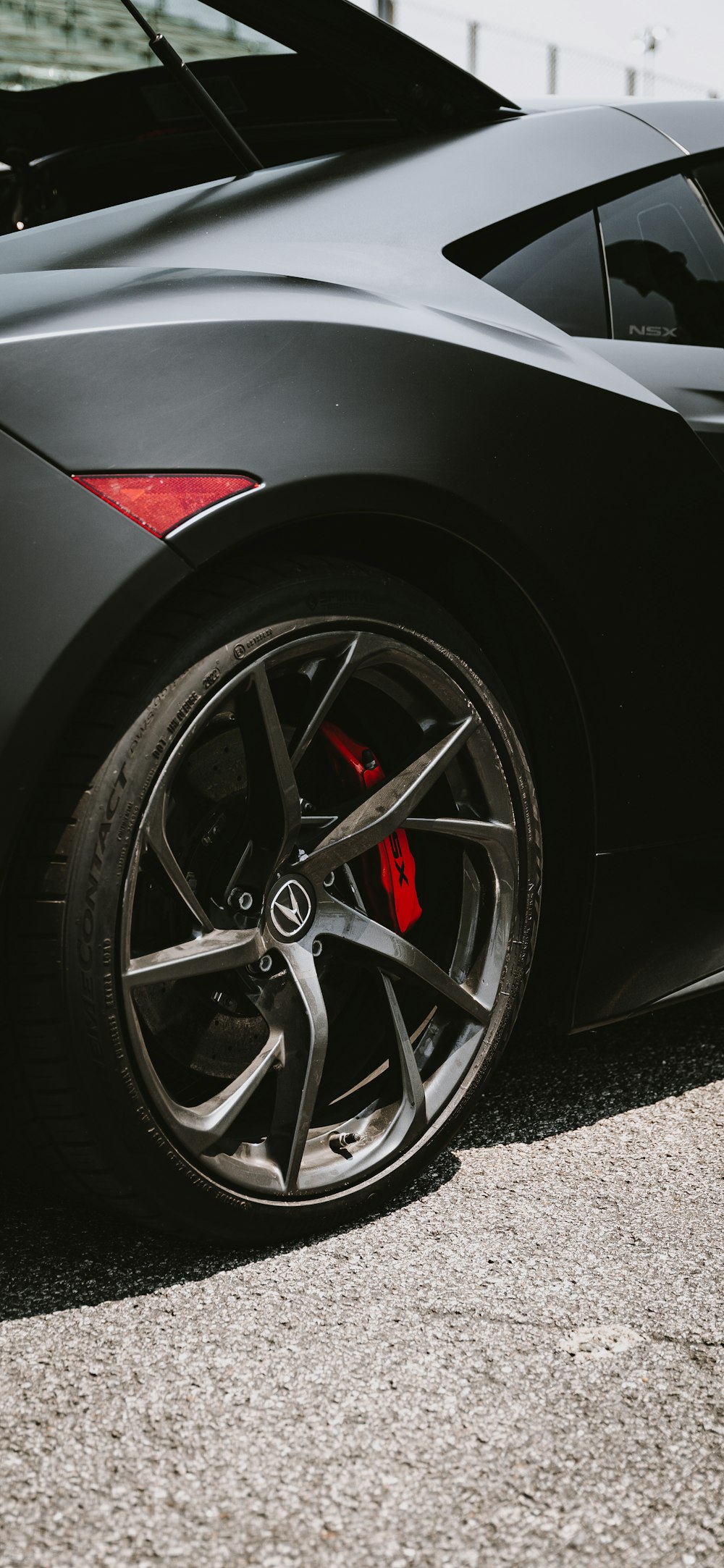 a black sports car parked on the side of the road