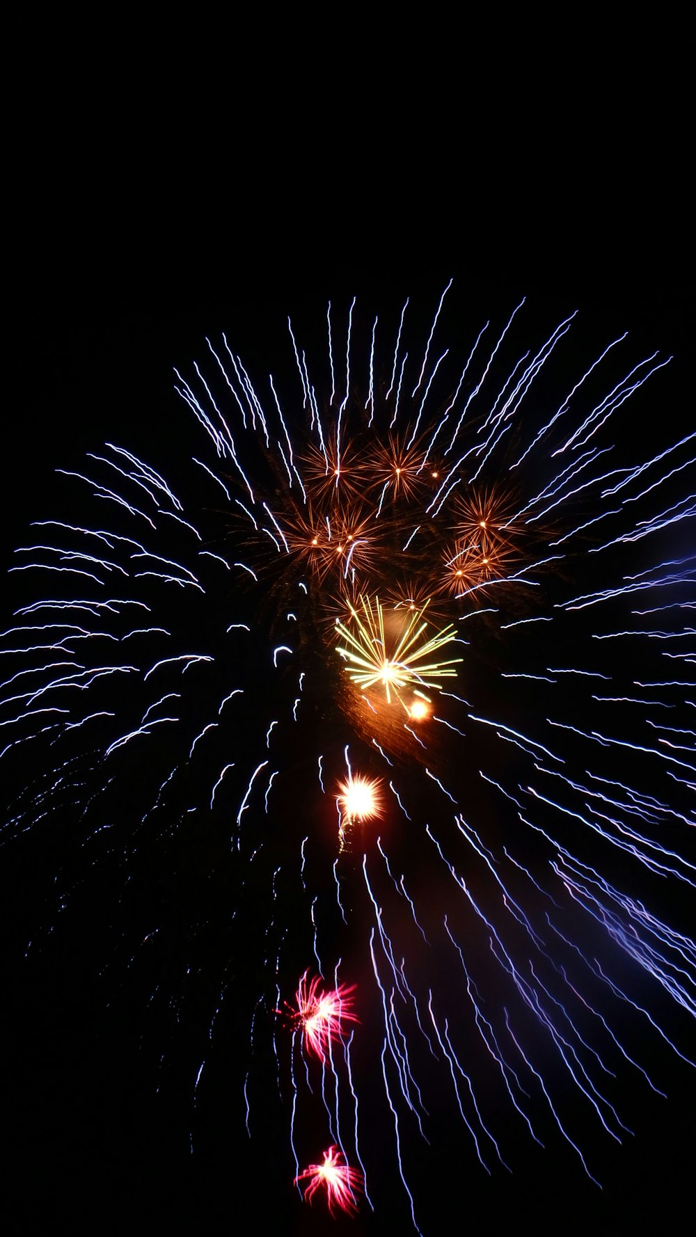 a colorful fireworks display in the night sky