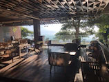 Inviting terrace seating with natural wood furniture and soft ambient lighting.