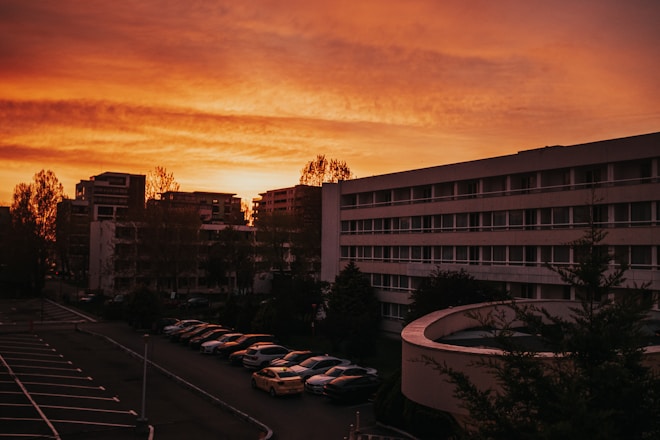 a parking lot filled with lots of parked cars