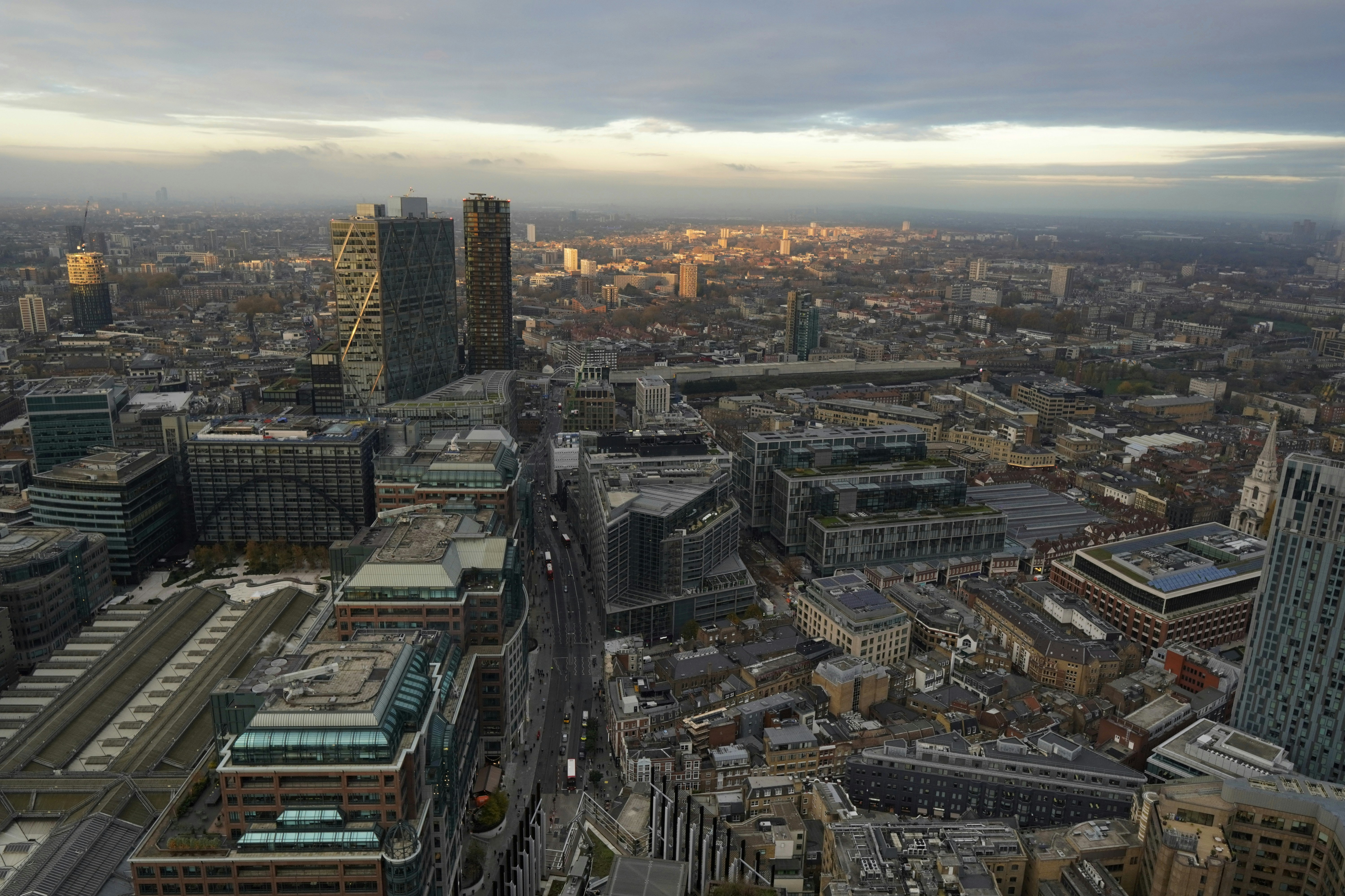 a view of a city from the top of a building, 