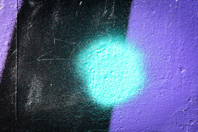 Interior painting project with deep black walls contrasted by bright blue trim.