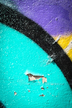 A close-up of intricate air-painting details on a wall.