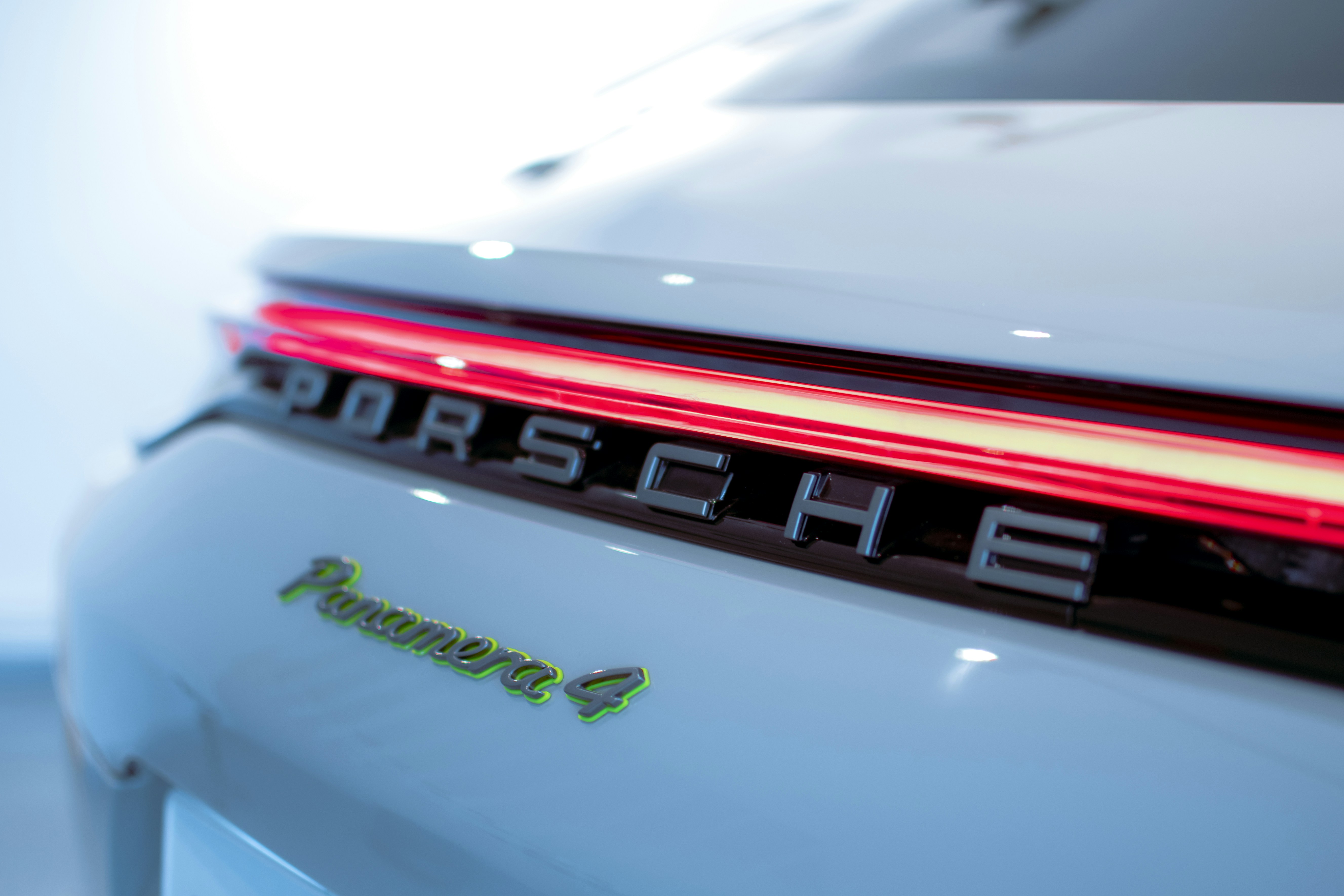 the back end of a white porsche car