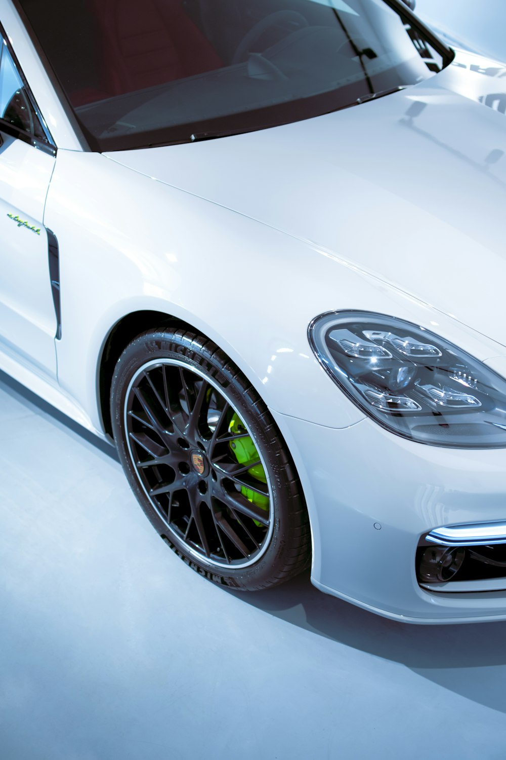 a white sports car parked in a garage