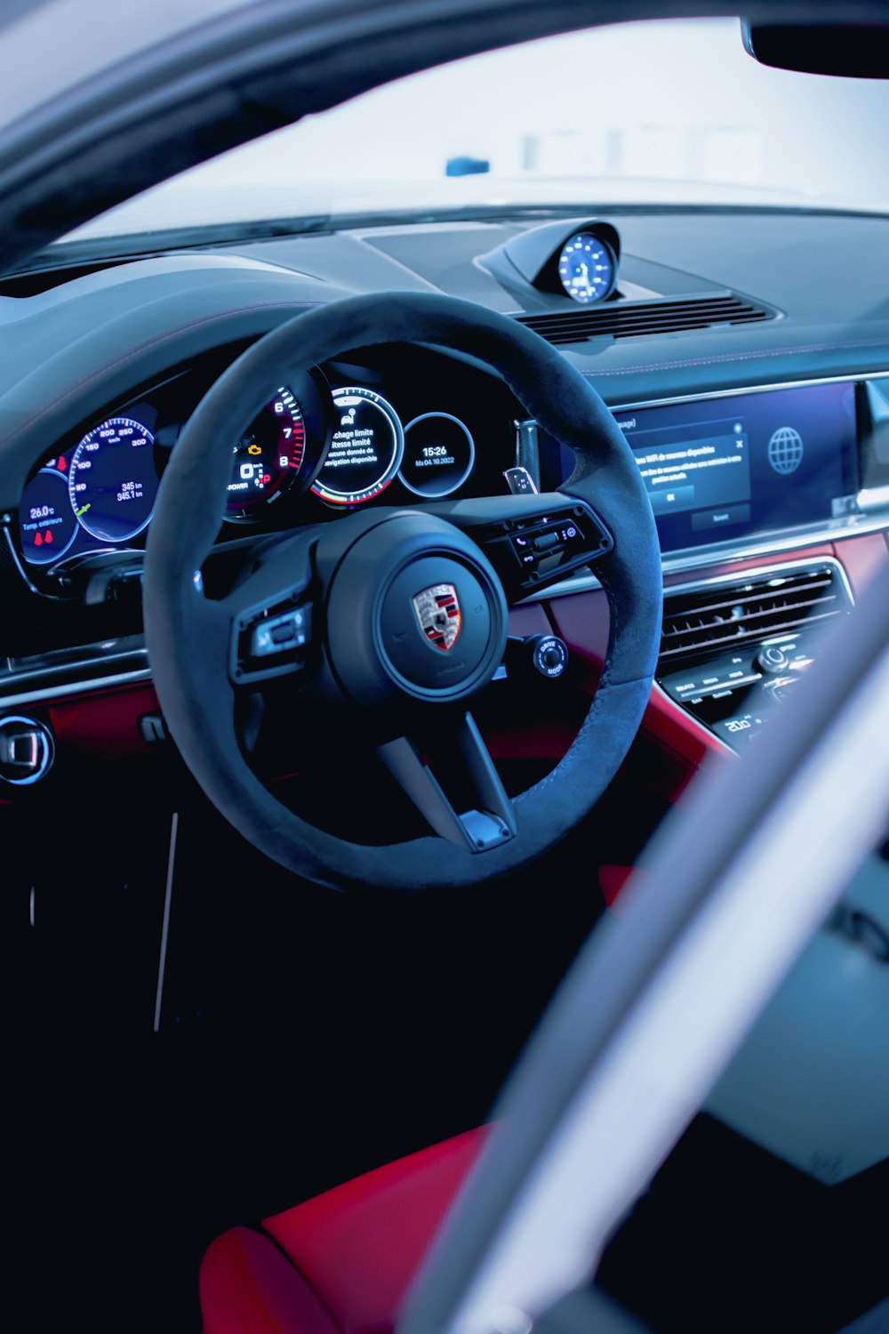 the interior of a car with a steering wheel and dashboard