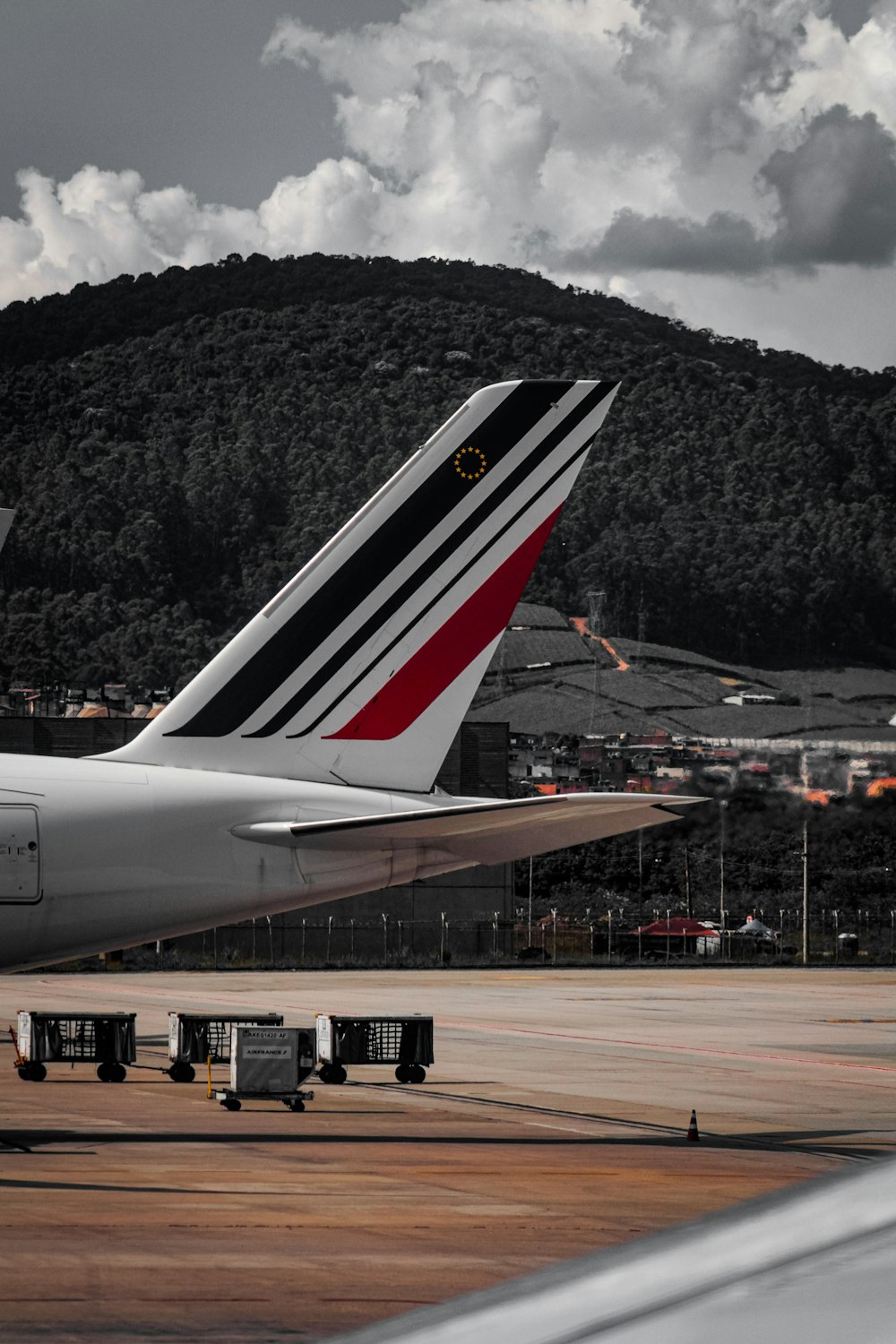 a large jetliner sitting on top of an airport tarmac