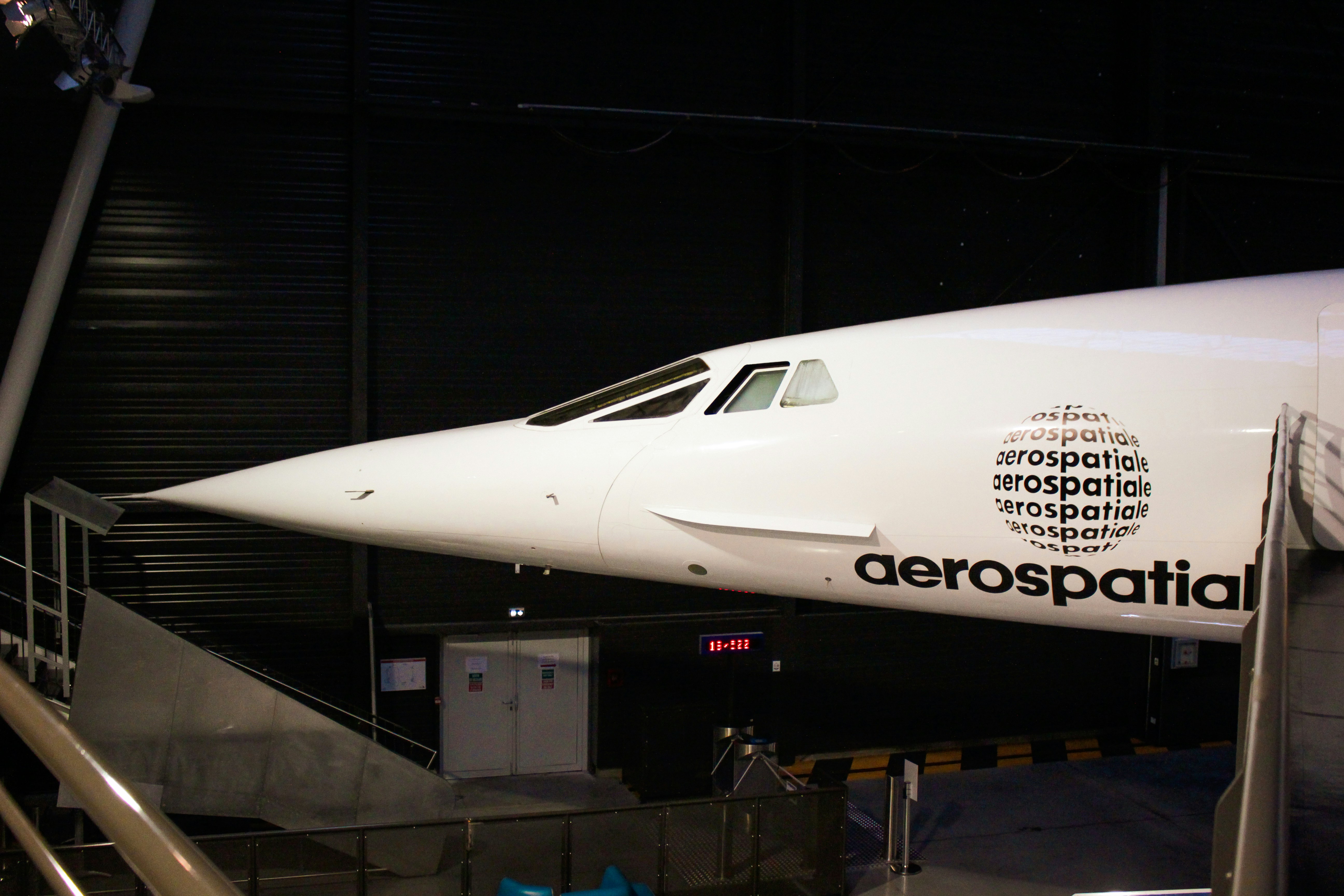 a large jetliner sitting on top of an airport tarmac, Concorde