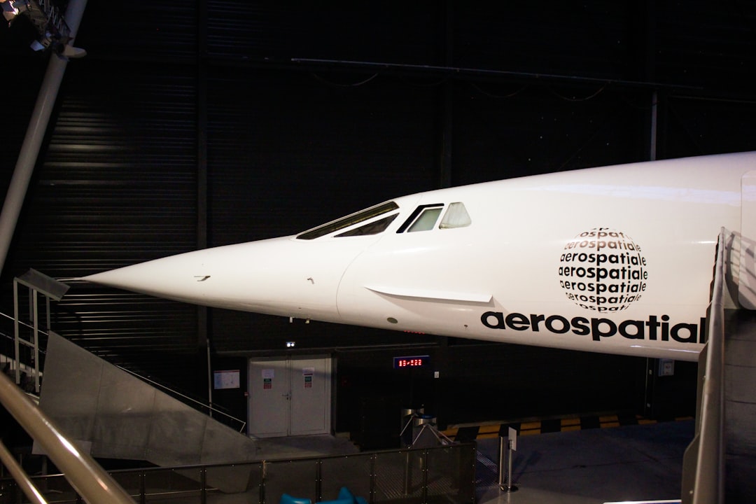 a large jetliner sitting on top of an airport tarmac, Concorde