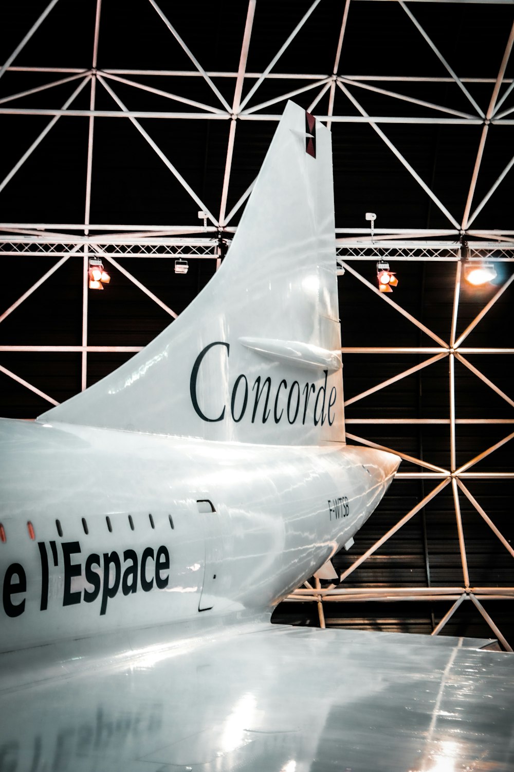 a large jetliner sitting inside of a hangar