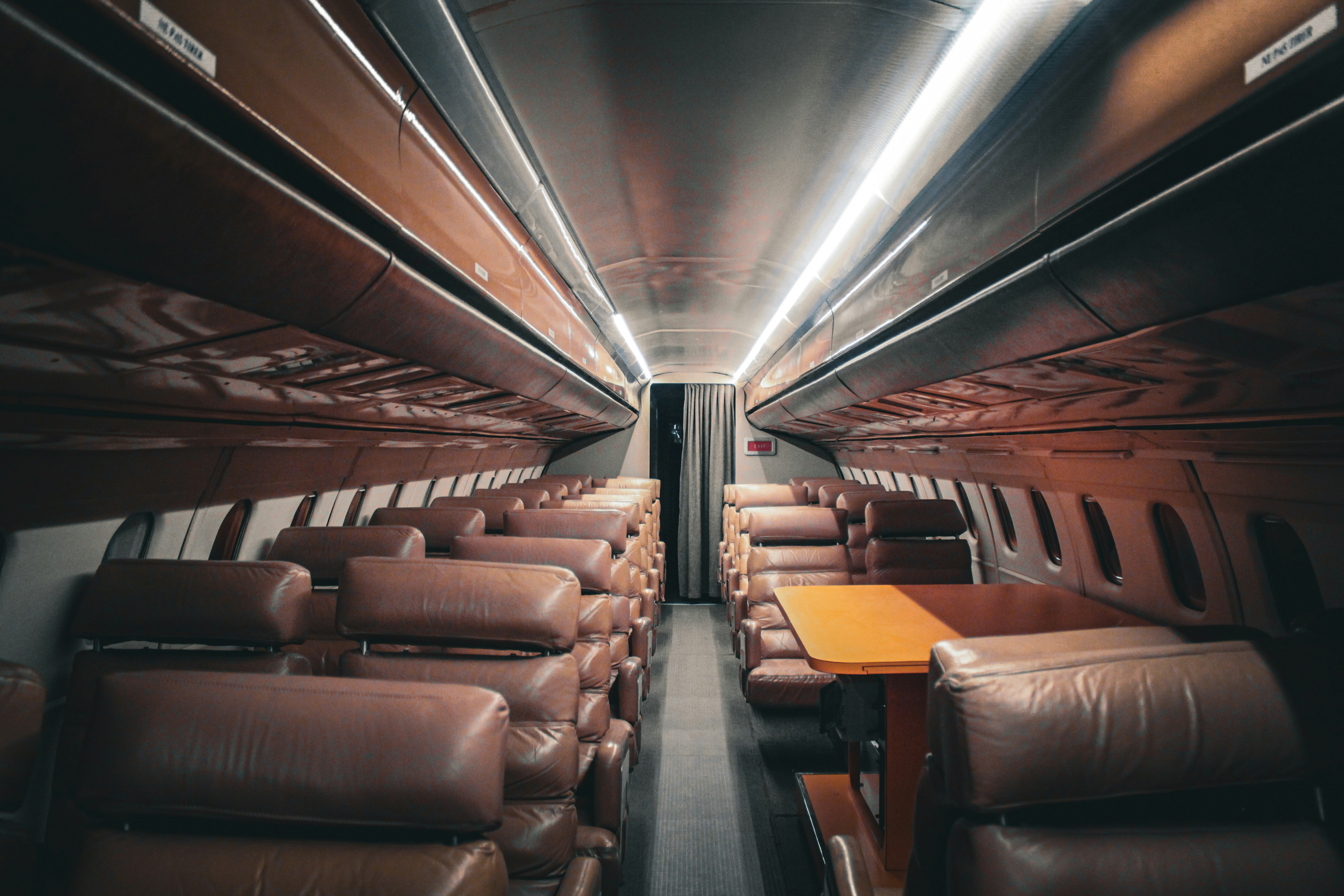the inside of a train with leather seats, The legendary Concorde from the inside!