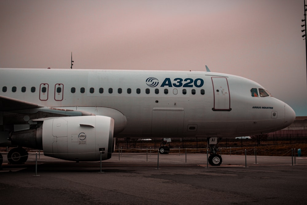 a large passenger jet sitting on top of an airport tarmac