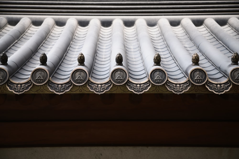 a close up of a building with a roof made of tile