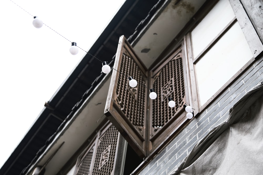 a building with a bunch of lights hanging from it's side