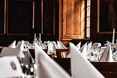 Luxurious event setup with gourmet dishes served elegantly in a refined venue.