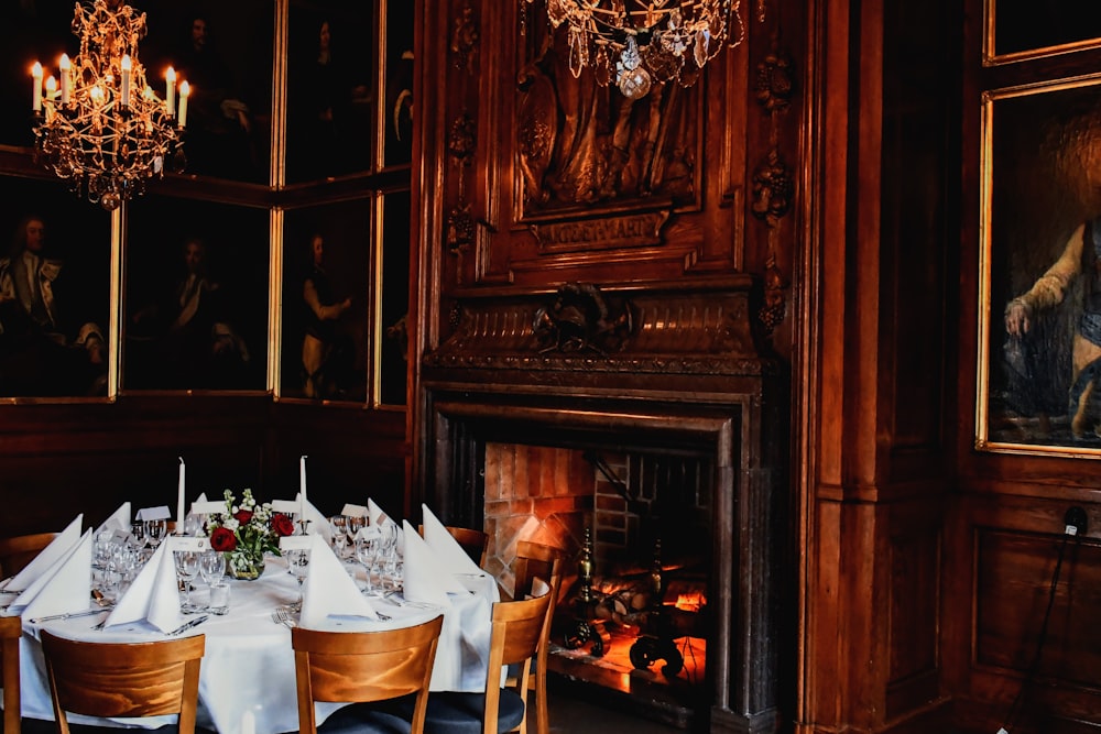 a dining room with a fire place and a fireplace