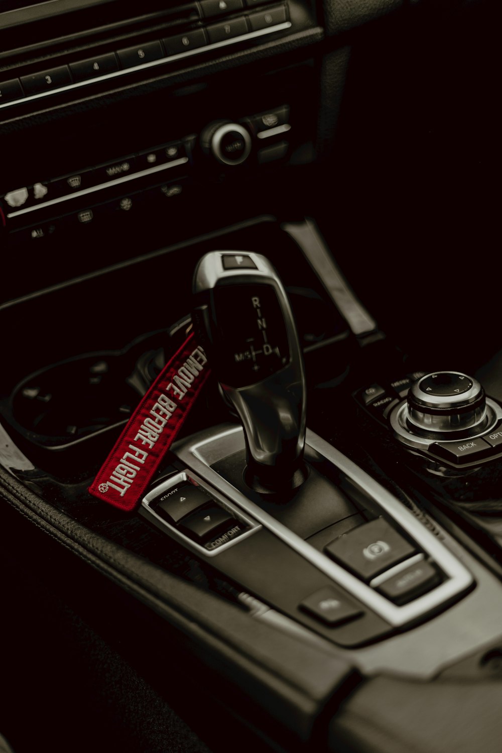 a close up of a steering wheel and a remote control