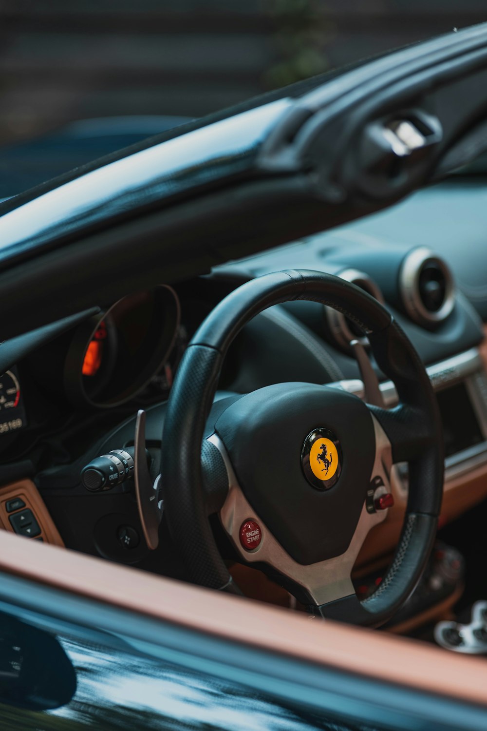 a close up of a car steering wheel and dashboard