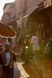 A candid photo of a lively street market bathed in warm afternoon light.