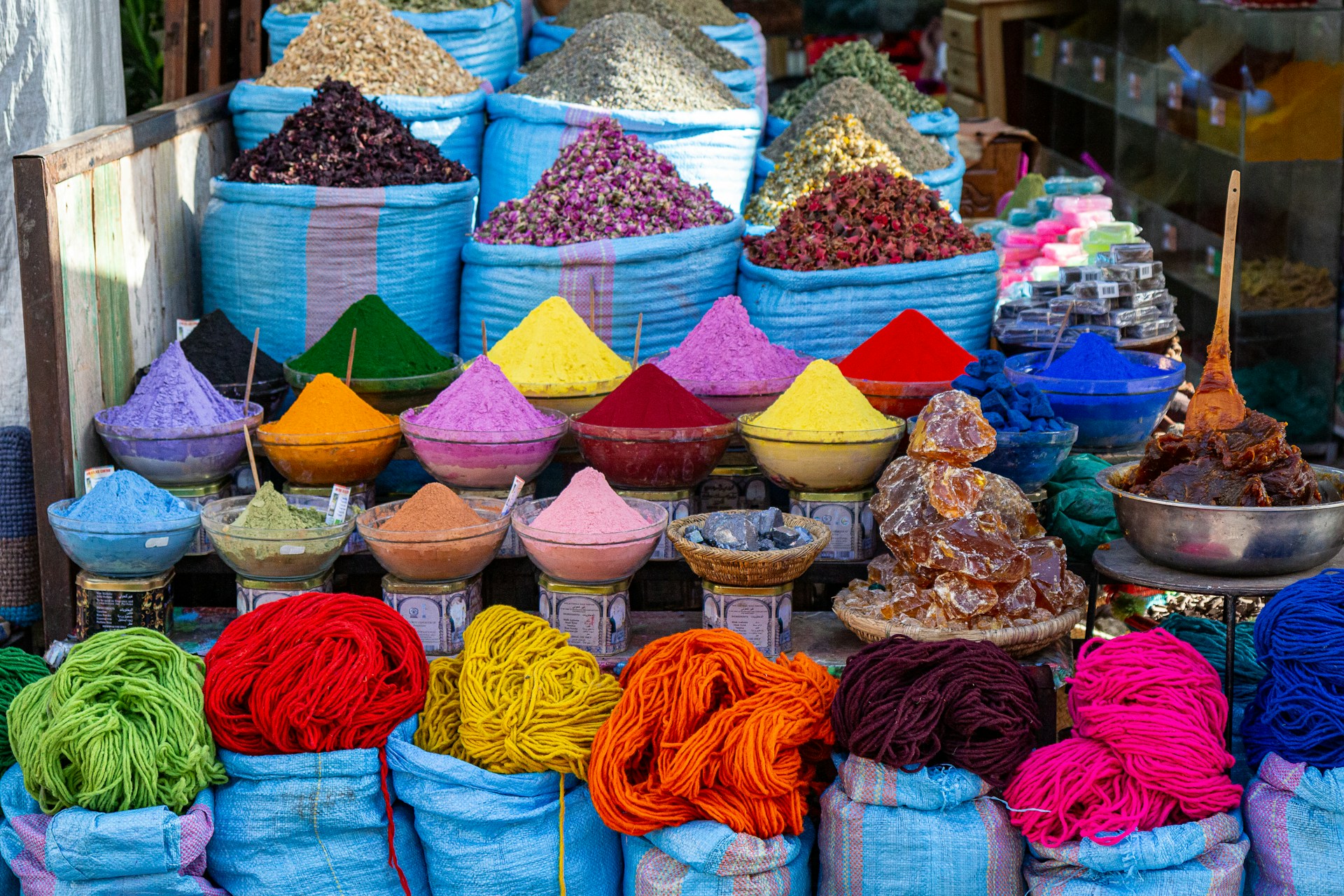 a bunch of bags filled with different colored items