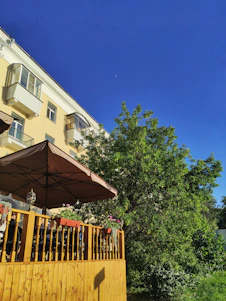 Bright and airy custom veranda with blue sky backdrop reflecting the brand colors.