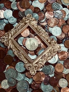 A collection of vintage coins displayed on a wooden surface.