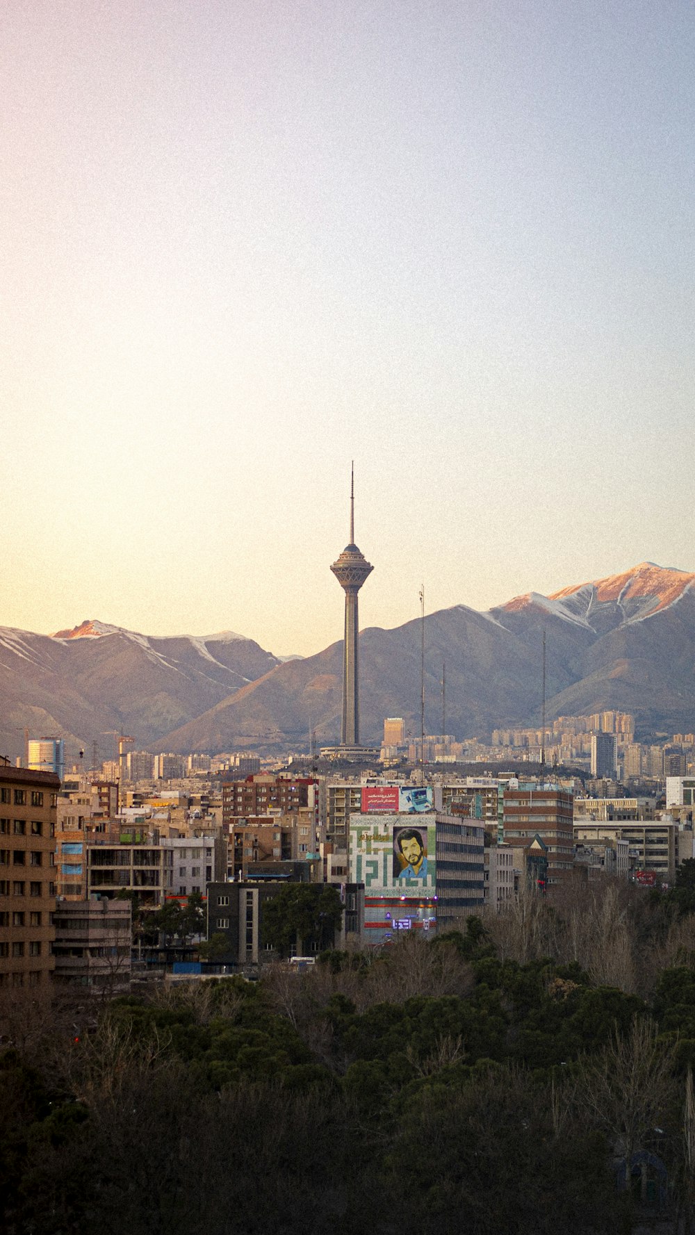 a view of a city with mountains in the background