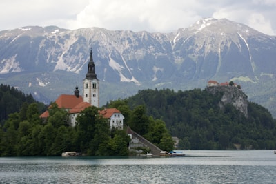 a church on a small island in the middle of a lake