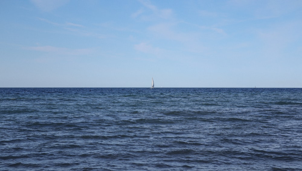 a sailboat in the middle of a large body of water