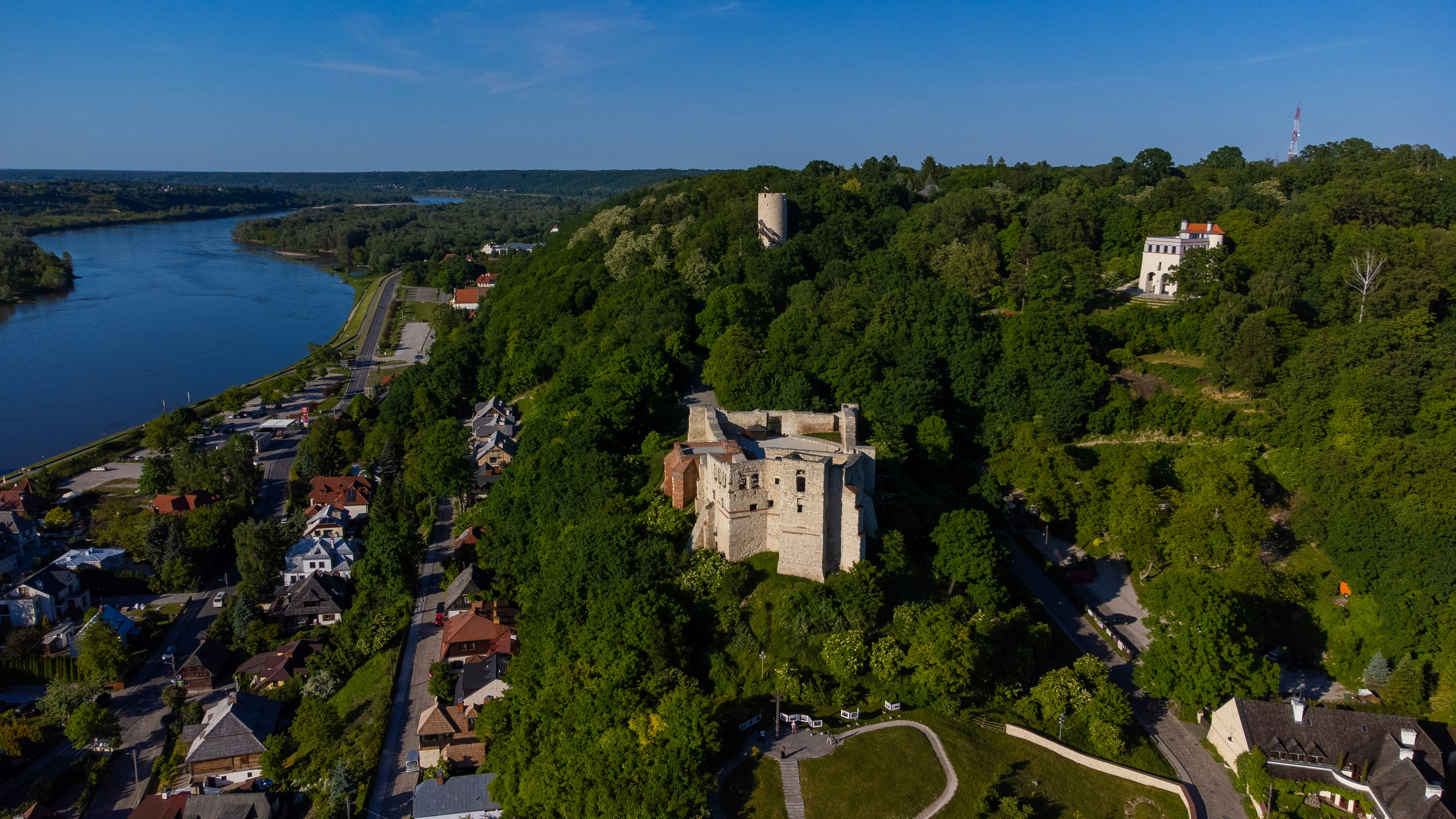 an aerial view of a castle surrounded by trees