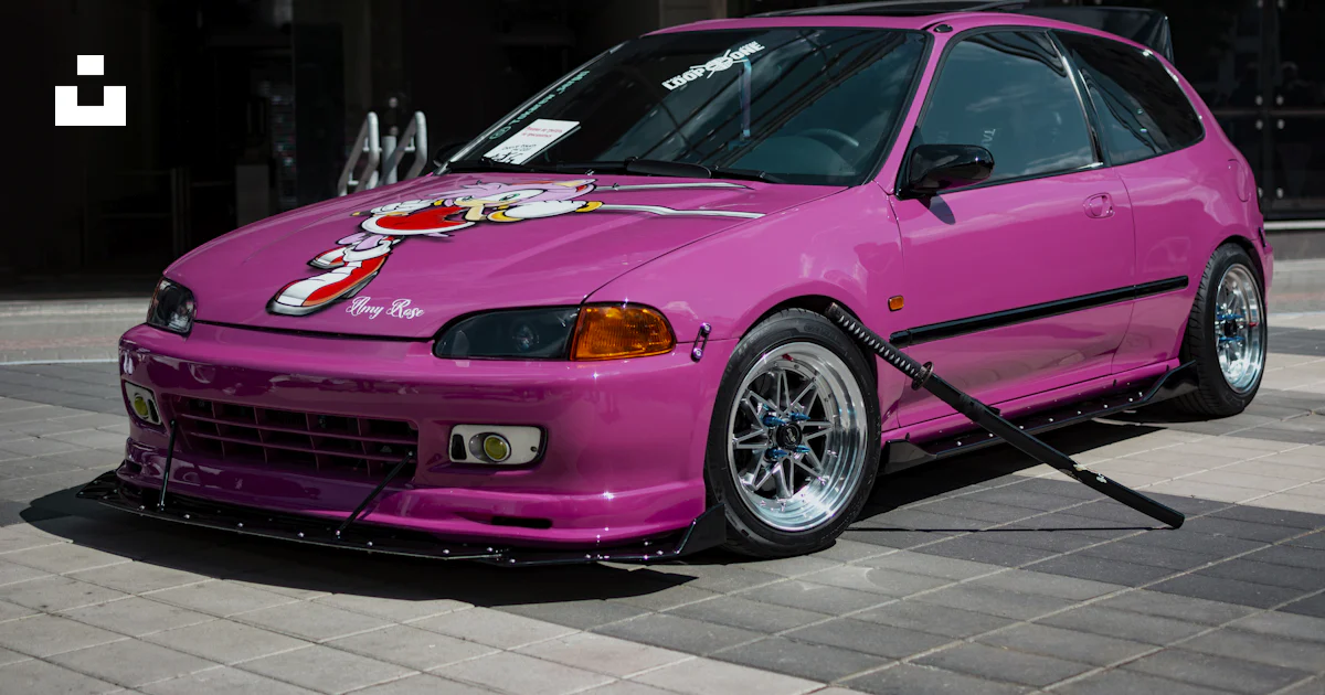 Pink Jdm Build A pink car parked in front of a building photo – Free Jdm Image on Unsplash