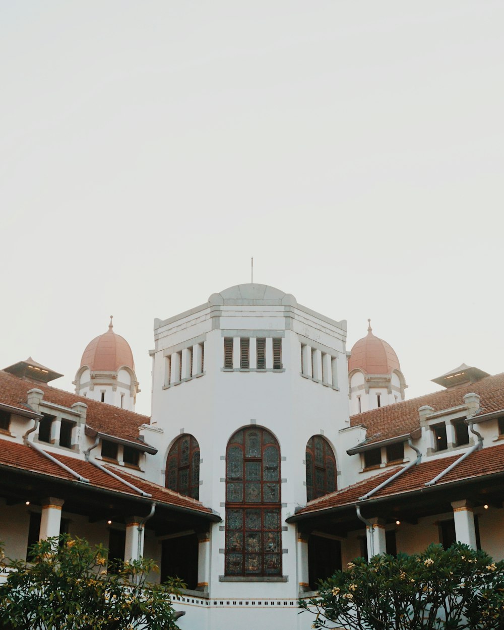 a large white building with a red roof