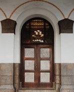 Photo of a residential front door with elegant design and sturdy frame.