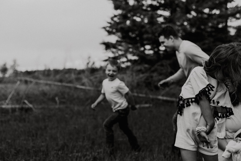 a couple of kids playing a game of frisbee