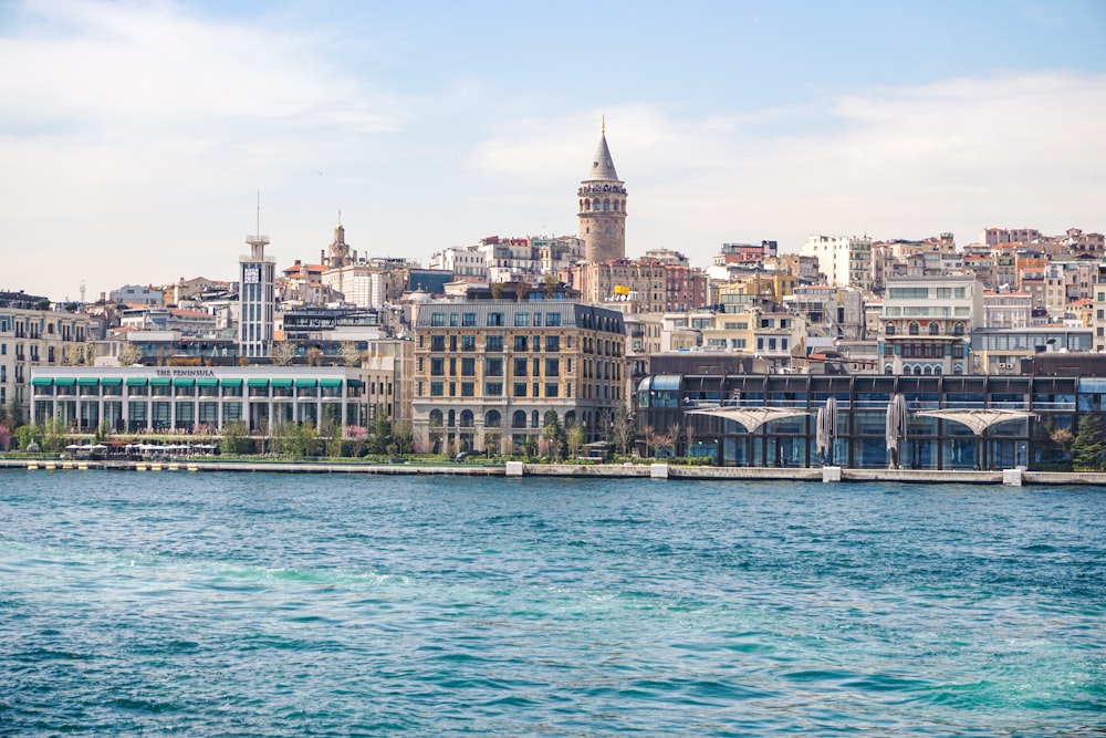 a large body of water with a city in the background