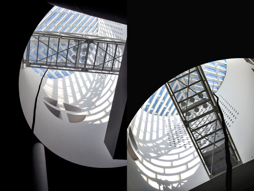 a spiral staircase in a building with a skylight