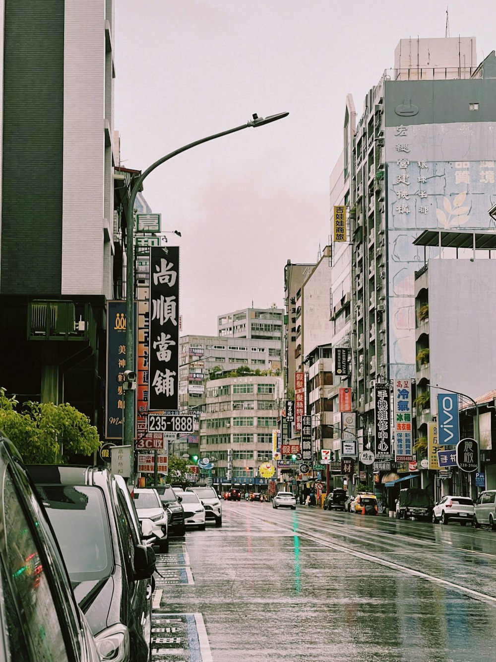 a city street filled with lots of tall buildings